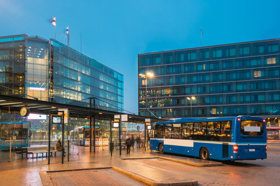 A bus stops at Helsinki Station.