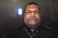 This photo provided by Elsie Hampton shows the Rev. Dr. Ron Hampton, a pastor at New Vision Community Church, a Free Methodist Church in Shreveport, La. Days before he died of COVID-19 on March 25, 2020, the 64-year-old Louisiana minister sent a live-streamed a Sunday message from his bed in a hospital isolation ward: Do not be afraid, be faithful and praise God. (Elsie Hampton via AP)