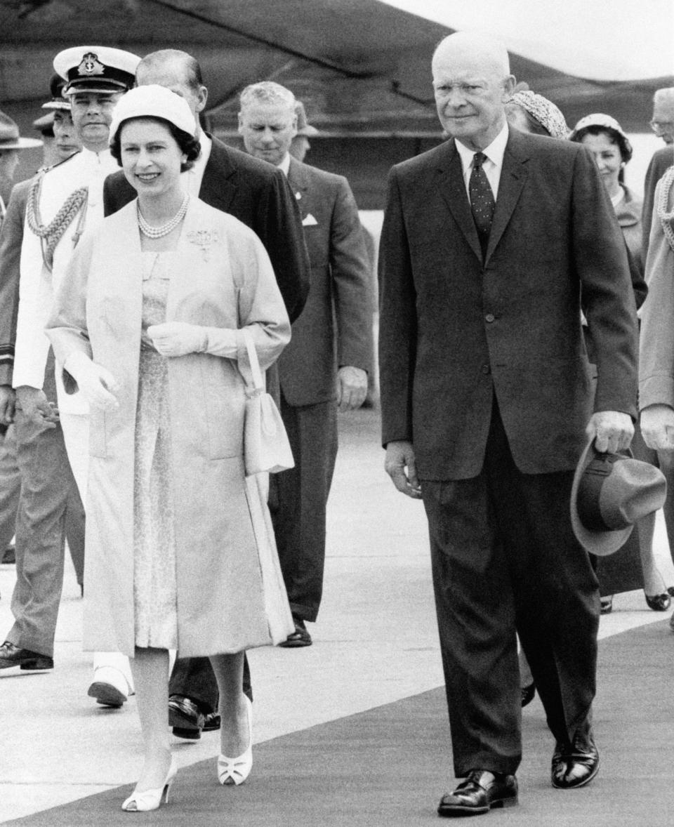 The Queen and President Dwight D. Eisenhower of America leaving the airstrip at St. Hubert, Quebec, where her Majesty greeted the President and his wife on their arrival in Canada.