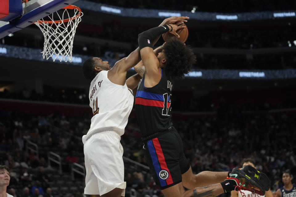 Cleveland Cavaliers forward Evan Mobley (4) blocks a Detroit Pistons forward Isaiah Livers (12) shot in the second half of an NBA basketball game in Detroit, Friday, Nov. 4, 2022. (AP Photo/Paul Sancya)