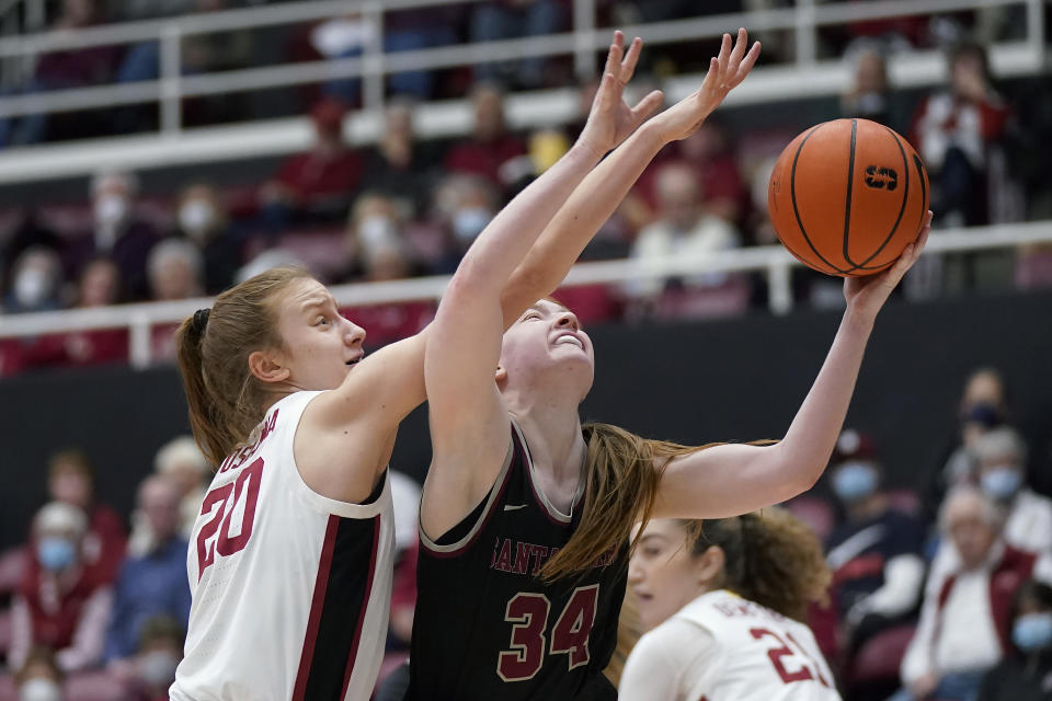 Santa Clara guard Tess Heal (34) shoots against Stanford guard Elena Bosgana (20) during the first half of an NCAA college basketball game in Stanford, Calif., Wednesday, Nov. 30, 2022. (AP Photo/Jeff Chiu)