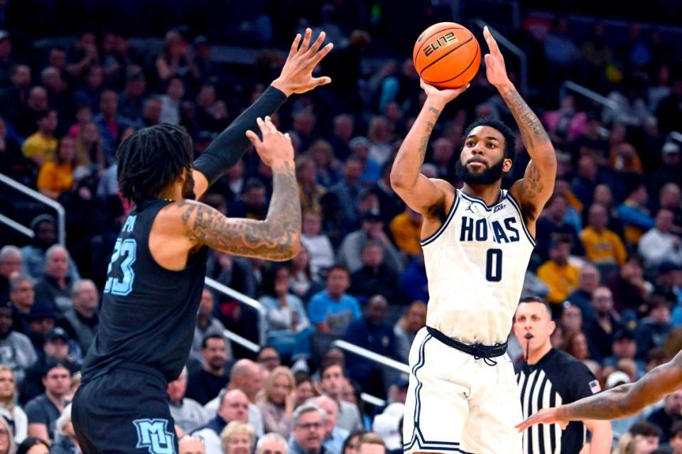 Georgetown’s Dontrez Styles (0) shoots over Marquette’s David Joplin (23) during their game at Capital One Arena in February 2024. Brad Mills/USA TODAY Sports