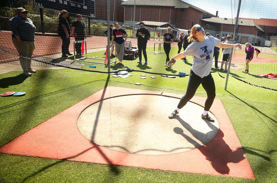 South Kitsap’s Grace Degarimore throws the discus during practice on Monday, April 22, 2024.