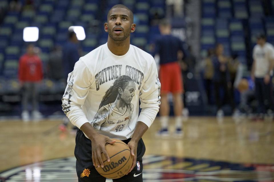 Phoenix Suns guard Chris Paul wears a Brittney Griner shirt for the recently released WNBA star before an NBA basketball game against the New Orleans Pelicans in New Orleans, Friday, Dec. 9, 2022. (AP Photo/Matthew Hinton)