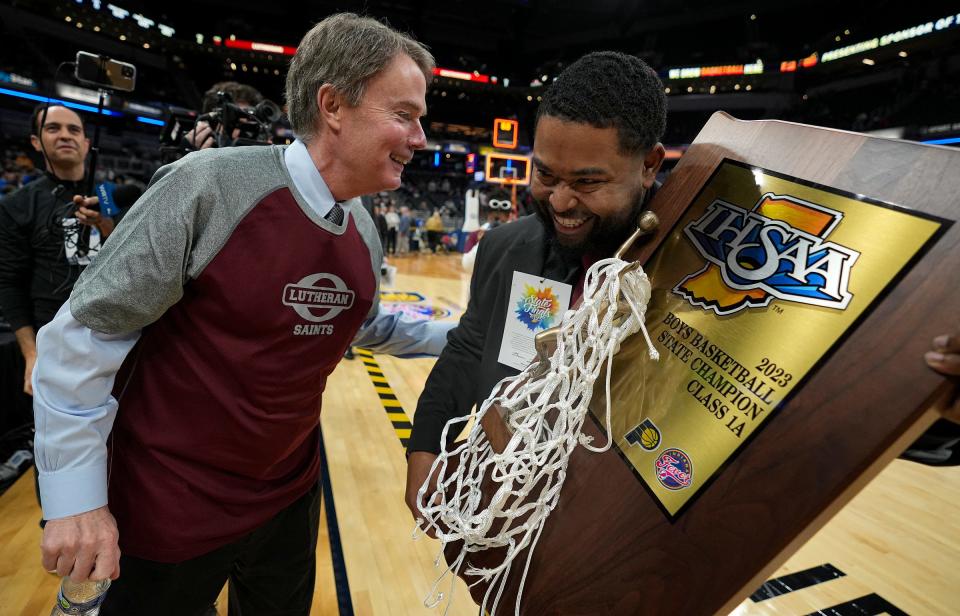 Indianapolis Mayor Joe Hogsett (left) congratulates Lutheran head coach Remus Woods after his team defeated Southwood, 97-66, for the IHSAA Class A state title Saturday, March 25, 2023, at Gainbridge Fieldhouse in Indianapolis.