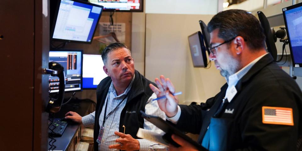 Traders work at the trading floor in the New York Stock Exchange in New York, the United States, Aug. 19, 2021.