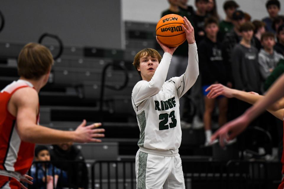 Fossil Ridge's Domenic Leone (23) rises for a jumper during a boys high school basketball playoff game against Chaparral at Fossil Ridge High School on Thursday, Feb. 23, 2022.
