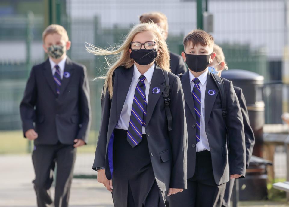 <p>Pupils wear masks at Outwood Academy Adwick in Doncaster</p> (PA)