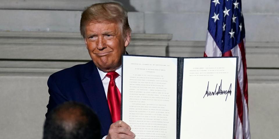 President Donald Trump holds a signed Constitution Day proclamation after he spoke to the White House conference on American History at the National Archives museum, Thursday, Sept. 17, 2020, in Washington.