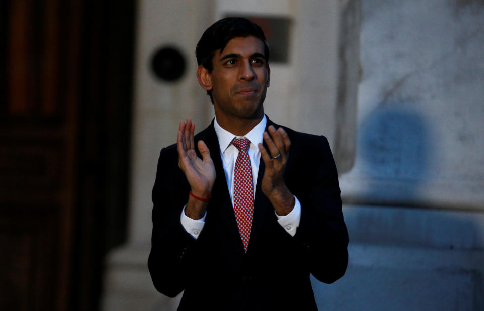 Chancellor Rishi Sunak clapping outside the Foreign and Commonwealth Office in London to salute local heroes during Thursday's nationwide Clap for Carers NHS initiative to applaud NHS workers fighting the coronavirus pandemic.