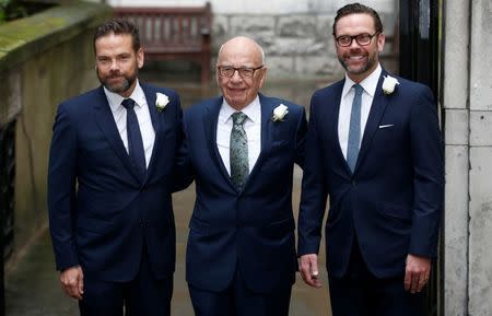 Media Mogul Rupert Murdoch (C) poses for a photograph with his sons Lachlan (L) and James as they arrive at St Bride's church for a service to celebrate the wedding between Murdoch and former supermodel Jerry Hall which took place on Friday, in London, Britain March 5, 2016. REUTERS/Peter Nicholls