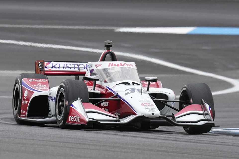 Jack Harvey, of England, drives into a turn during practice for the IndyCar Grand Prix auto race at Indianapolis Motor Speedway, Friday, May 12, 2023, in Indianapolis. (AP Photo/Darron Cummings)