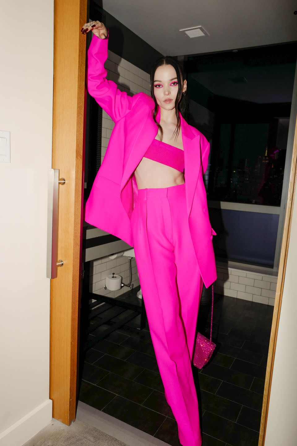 <p>Full look!! I went with this immaculately tailored suit. I love a more masculine silhouette contrasted with the celebration of femme energy that is the iconic Valentino hot pink and jeweled accessories.</p>