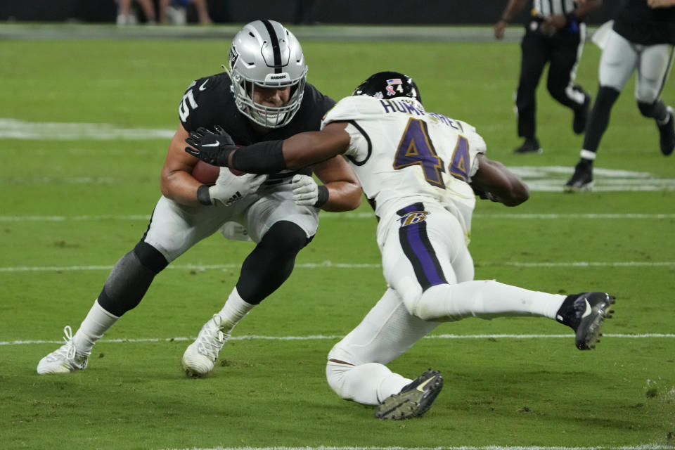 Baltimore Ravens cornerback Marlon Humphrey (44) tackles Las Vegas Raiders fullback Alec Ingold (45) during the second half of an NFL football game, Monday, Sept. 13, 2021, in Las Vegas. (AP Photo/Rick Scuteri)