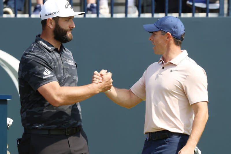 Spain's Jon Rahm shakes hands with Northern Ireland's Rory Mcllroy at the 151st Open Championship on Thursday at Royal Liverpool Golf Club in Hoylake, England. Photo by Hugo Philpott/UPI