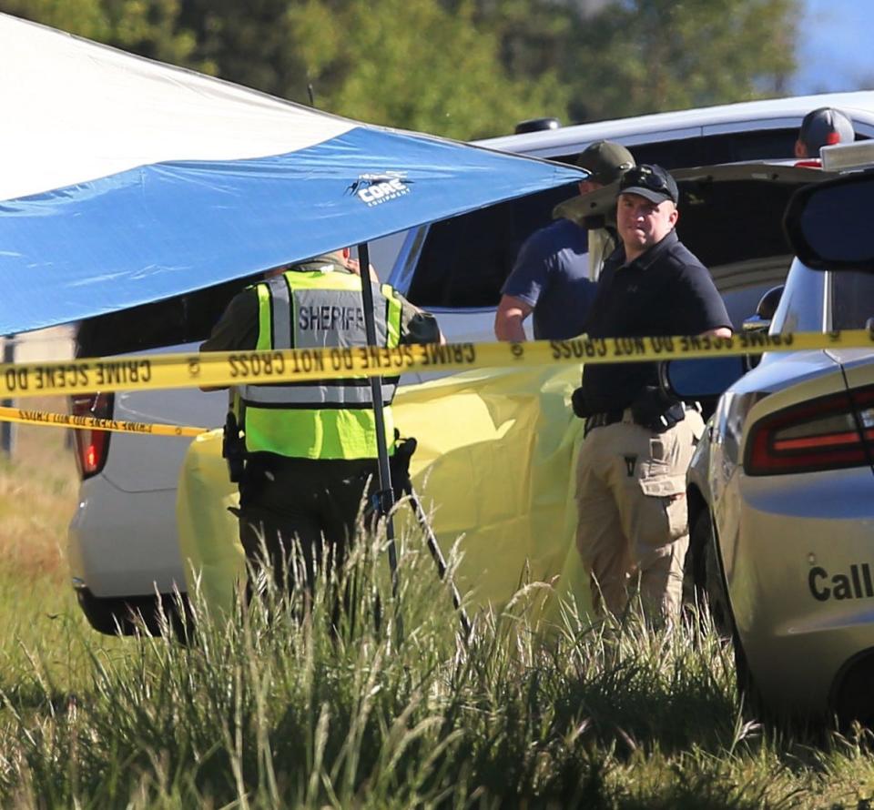 Law enforcement secures the scene of a traffic stop on Interstate 5 north of Eugene April 23, 2024.