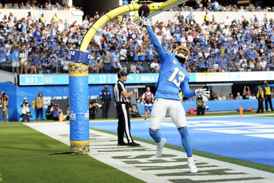 Los Angeles Chargers wide receiver Keenan Allen (13) celebrates his touchdown catch during the first half an NFL football game against the Detroit Lions Sunday, Nov. 12, 2023, in Inglewood, Calif. (AP Photo/Gregory Bull)