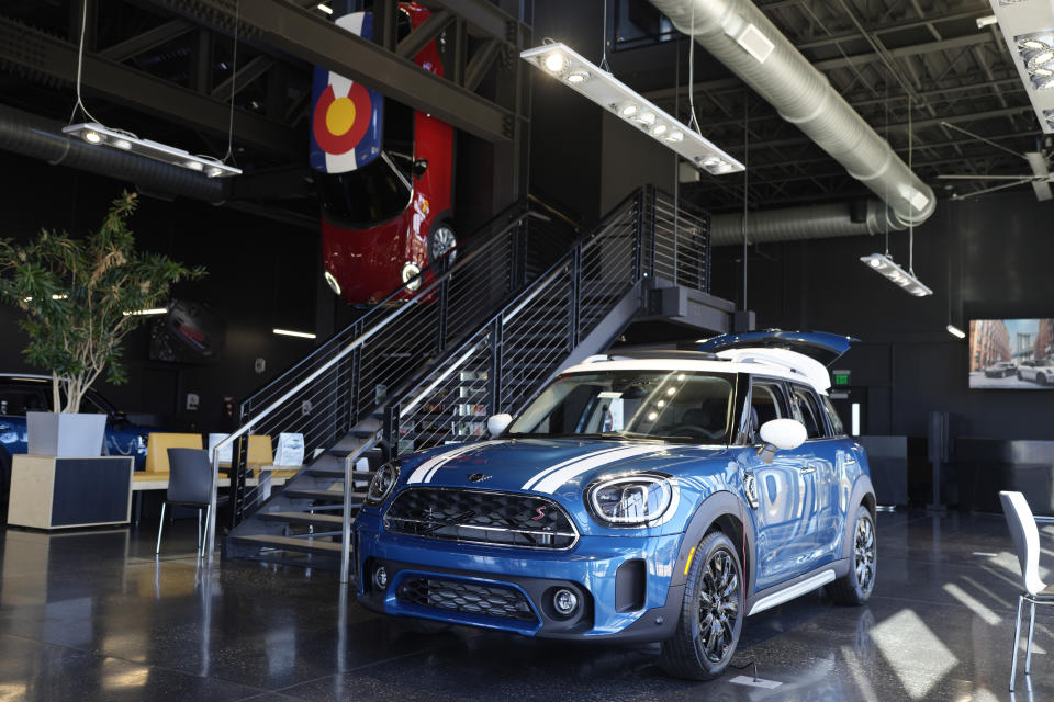 A 2024 Cooper Countryman S sports-utility vehicle is displayed at a Mini dealership Saturday, Oct. 21, 2023, in Highlands Ranch, Colo. A surge in U.S. consumer spending is fueling economic growth, reflecting a resilience among households that has confounded economists, Federal Reserve officials and even the sentiments that Americans themselves have expressed in surveys. (AP Photo/David Zalubowski)