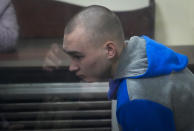 Russian army Sergeant Vadim Shishimarin, 21, is seen behind a glass during a court hearing in Kyiv, Ukraine, Wednesday, May 18, 2022. The Russian soldier has gone on trial in Ukraine for the killing of an unarmed civilian. The case that opened in Kyiv marked the first time a member of the Russian military has been prosecuted for a war crime since Russia invaded Ukraine 11 weeks ago. (AP Photo/Efrem Lukatsky)