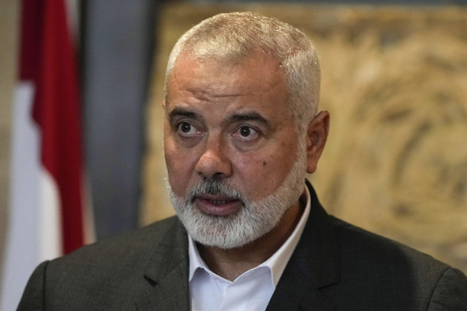 FILE - Ismail Haniyeh, the leader of the Palestinian militant group Hamas, speaks to journalists after his meeting with Lebanese Parliament Speaker Nabih Berri, in Beirut, Lebanon, on June 28, 2021. The Hamas officials are accused by the ICC of planning and instigating eight war crimes and crimes against humanity, among them extermination, murder, taking hostages, rape and torture. (AP Photo/Hassan Ammar, File)