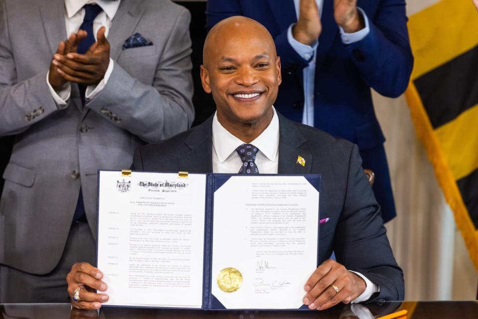 Maryland Governor Wes Moore holds an executive order pardoning 175,000 cannabis-related convictions at the Maryland State House in Annapolis, Maryland on June 17 (EPA)