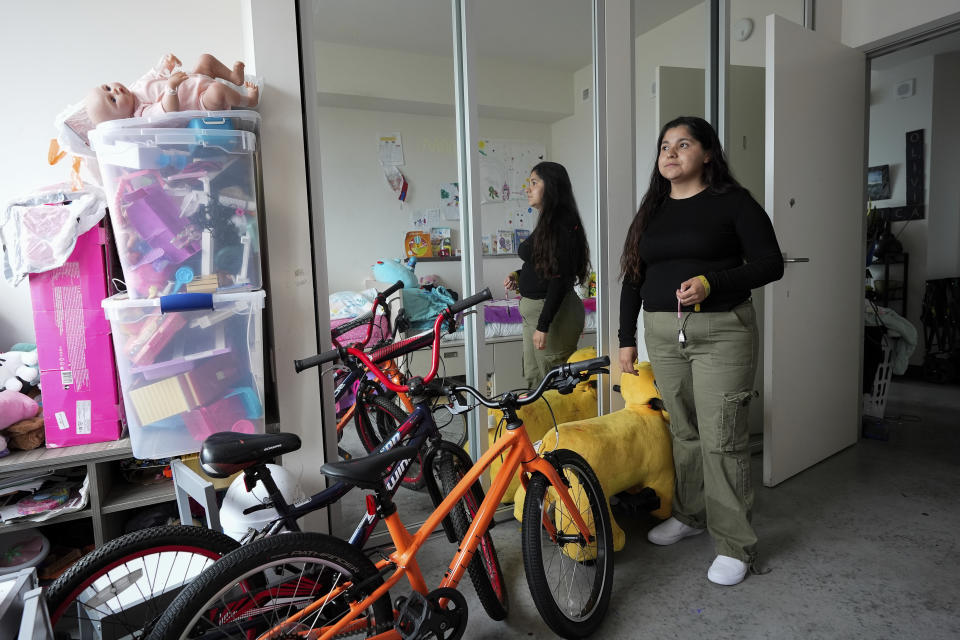 Danica Gutierrez is photographed inside her daughters' bedroom Thursday, June 13, 2024, in San Francisco. Gutierrez and her three daughters moved into a three-bedroom unit in a complex with wi-fi and a rooftop garden, but says she doesn't feel her girls are safe since some of her neighbors are struggling with addiction and mental illness. (AP Photo/Godofredo A. Vásquez)