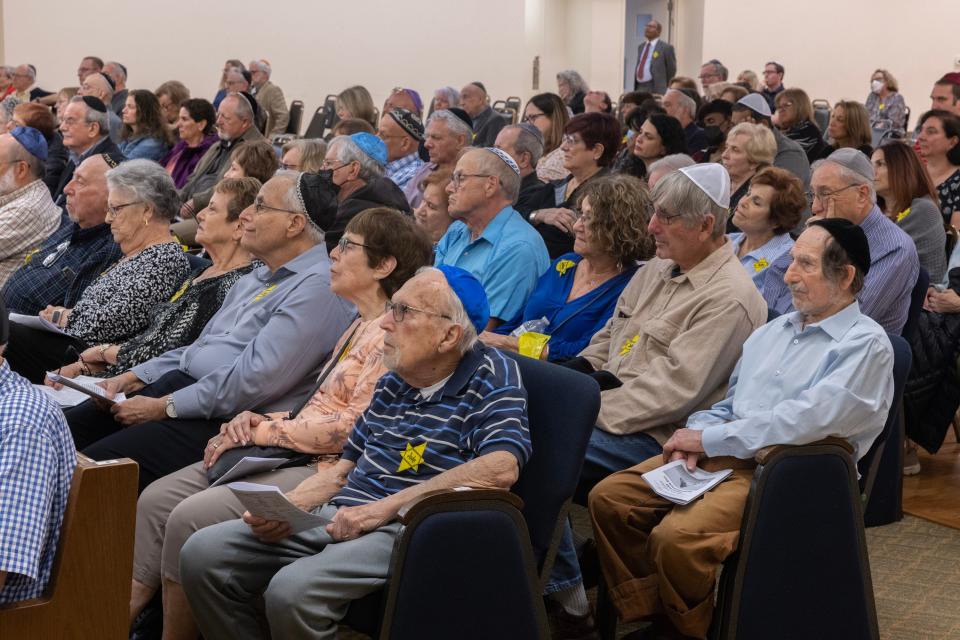 Attendees listen quietly as keynote speaker Ruth Millman spoke. Holocaust Remembrance Day at Congregation Ahavat Olam in Howell on April 17, 2023. 