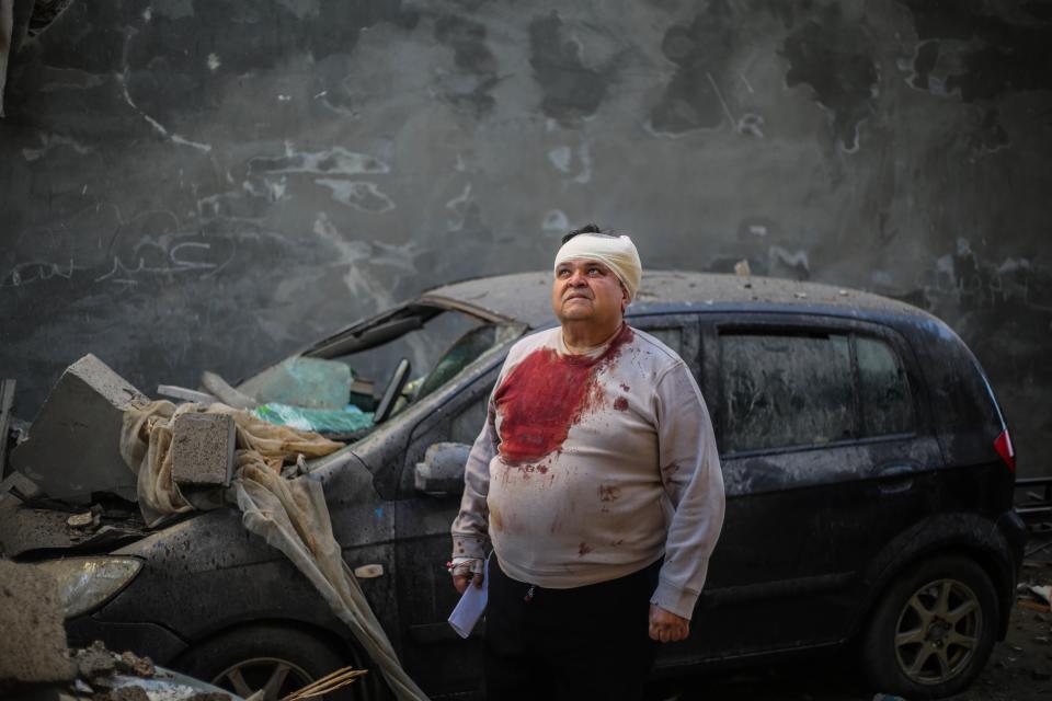 A person inspects damage caused to their home following Israeli air strikes, on February 07, 2024 in Rafah, Gaza.