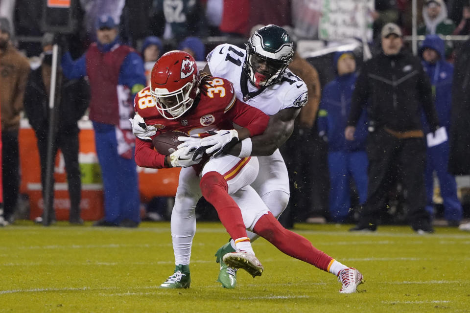 Kansas City Chiefs cornerback L'Jarius Sneed (38) intercepts a pass intended for Philadelphia Eagles wide receiver A.J. Brown (11) during the first half of an NFL football game, Monday, Nov. 20, 2023, in Kansas City, Mo. (AP Photo/Ed Zurga)
