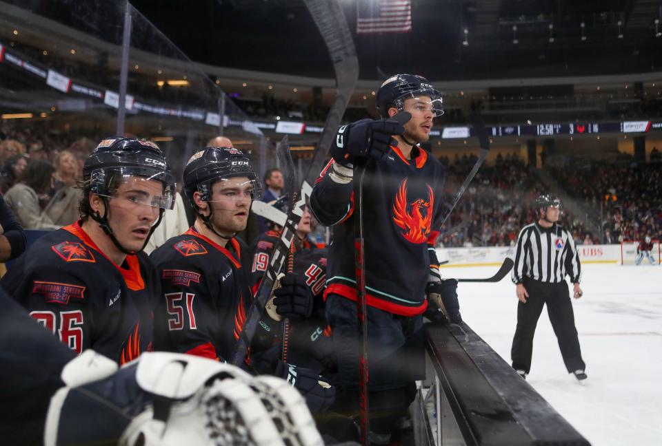 The Coachella Valley Firebirds bench watches the action during their game against the Ontario Reign at Acrisure Arena in Palm Desert, Calif., April 12, 2023. 