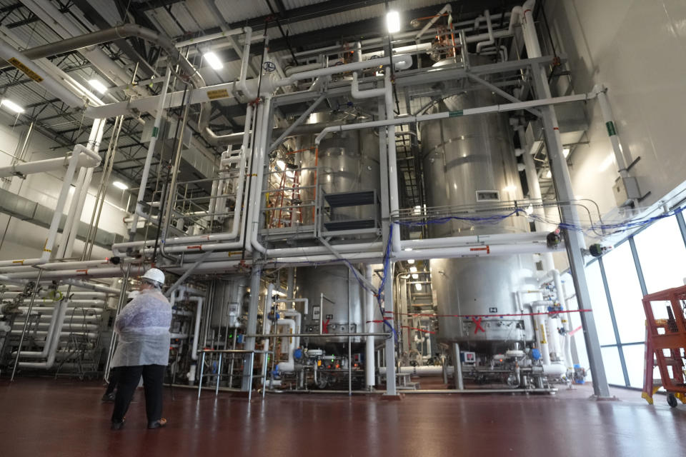 Fermentation tanks containing mushroom roots stand in the production facility of Meati Wednesday, July 26, 2023, in Thornton, Colo. In four days, a single microscopic spore can produce the equivalent of a whole cow’s worth of meat. (AP Photo/David Zalubowski)