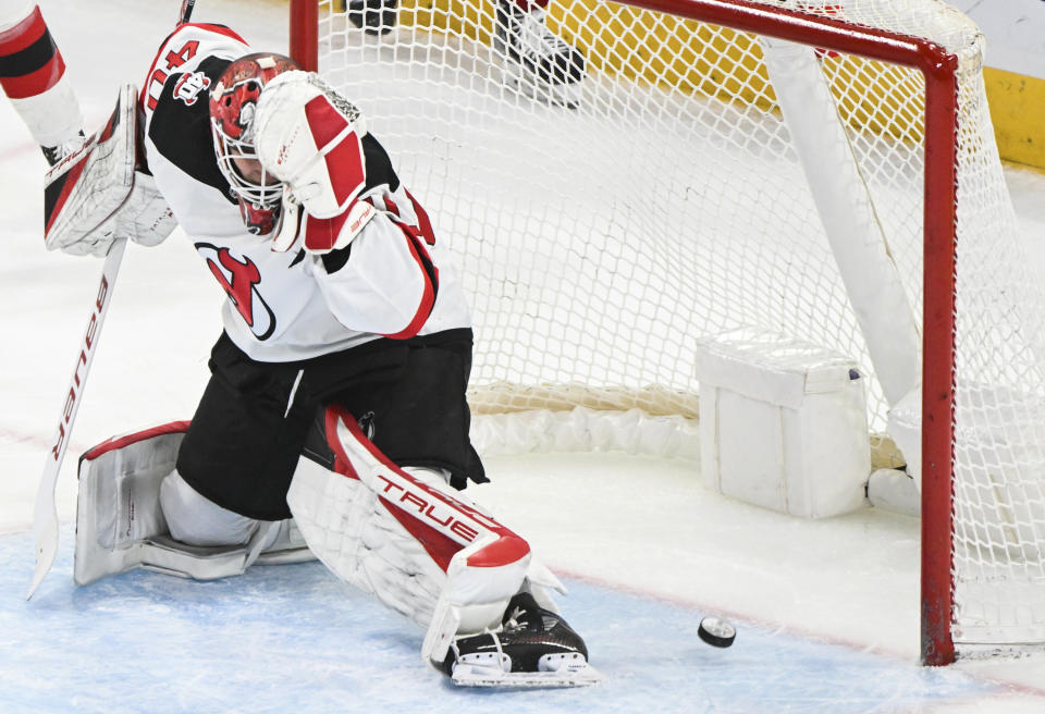 New Jersey Devils goaltender Akira Schmid gives up a goal to Montreal Canadiens' Denis Gurianov during the second period of an NHL hockey game Saturday, March 11, 2023, in Montreal. (Graham Hughes/The Canadian Press via AP)