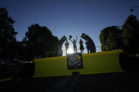 Stage winner Belgium's Jasper Philipsen celebrates on the podium after the twenty-first stage of the Tour de France cycling race over 116 kilometers (72 miles) with start in Paris la Defense Arena and finish on the Champs Elysees in Paris, France, Sunday, July 24, 2022. (AP Photo/Thibault Camus)