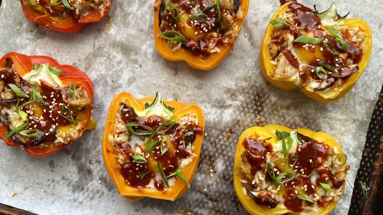 korean stuffed bell peppers with egg and gochujang on baking sheet