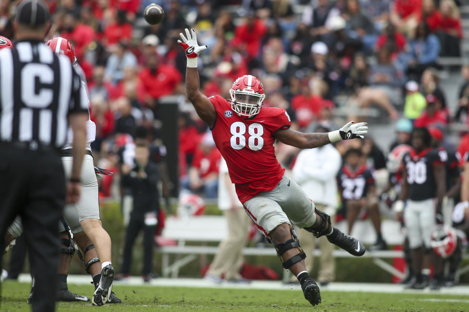 FILE - Georgia defensive lineman Jalen Carter (88) reaches for a ball in the second half of Georgia's spring NCAA college football game, Saturday, April 16, 2022, in Athens, Ga. Georgia's football season is set to begin on Sept. 3, 2022, against Oregon. (AP Photo/Brett Davis, File)