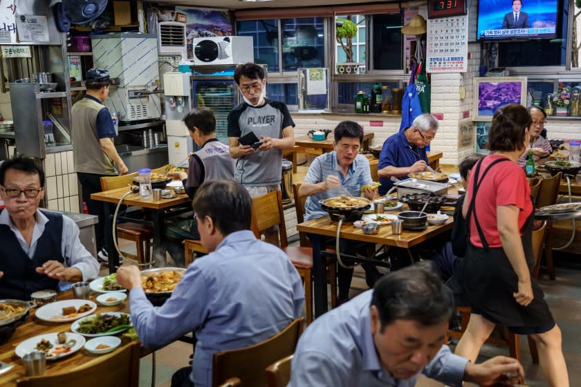 SEOUL, SOUTH KOREA -- THURSDAY, JULY 16, 2020: Taxi drivers dine at Ilsin Gisa Sikdang in Seoul, South Korea, on July 16, 2020. (Marcus Yam / Los Angeles Times)