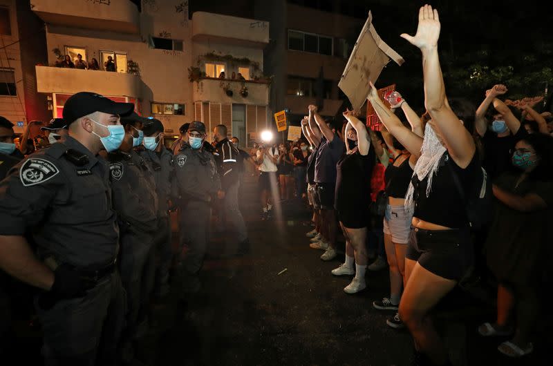 Israelis protest against law that limits protests during the coronavirus disease (COVID-19) lockdown, in Tel Aviv