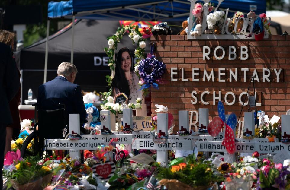 Texas Gov. Greg Abbott visits a memorial at Robb Elementary School in Uvalde, Texas