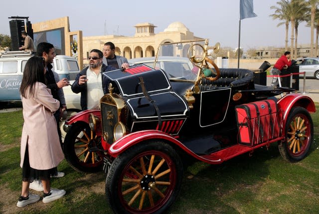 Egyptian collector Mohamed Wahdan talks to people about his 1924 Ford T at a public show in Cairo, Egypt