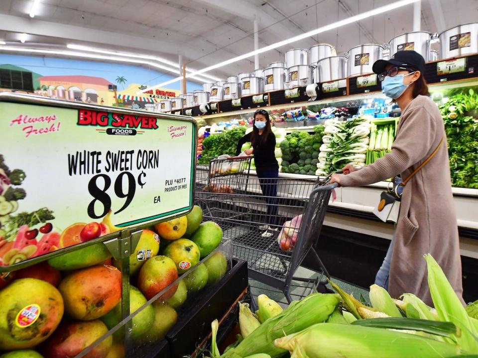 People grocery shopping in Rosemead, California on April 21, 2022.