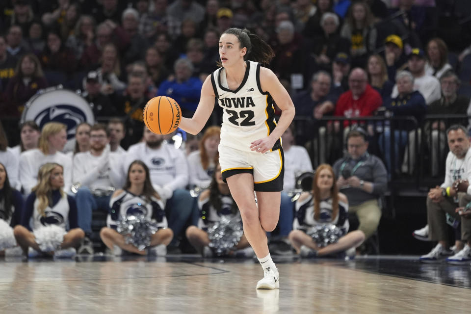 Iowa guard Caitlin Clark dribbles down the court during the second half of an NCAA college basketball quarterfinal game against Penn State at the Big Ten women's tournament Friday, March 8, 2024, in Minneapolis. (AP Photo/Abbie Parr)