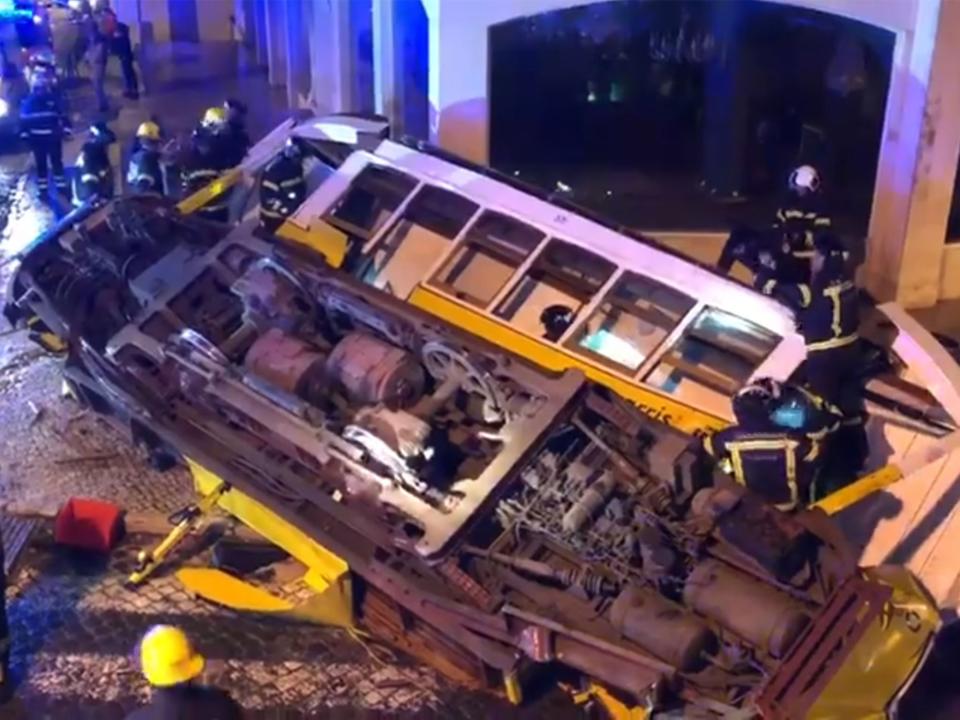 Witnesses saw people a baby and child to safety from the wreckage of the tram: Francisco Moura Pinheiro/screengrab