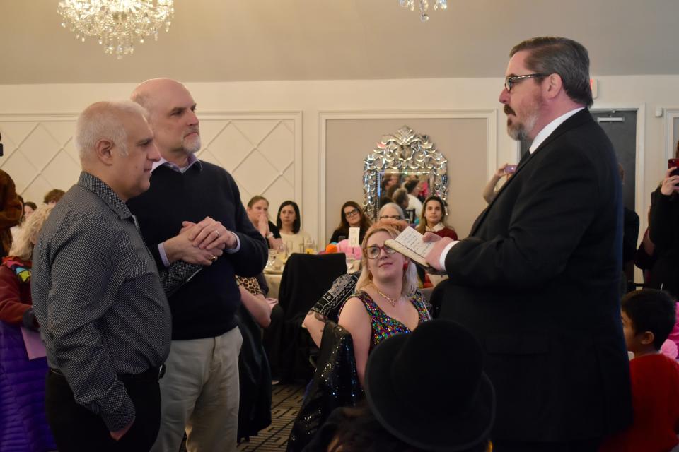 Former New Paltz Mayor Jason West officiates the vow renewal of Jay Blotcher, left, and Brook Garrett, whose union he solemnized 20 years prior.