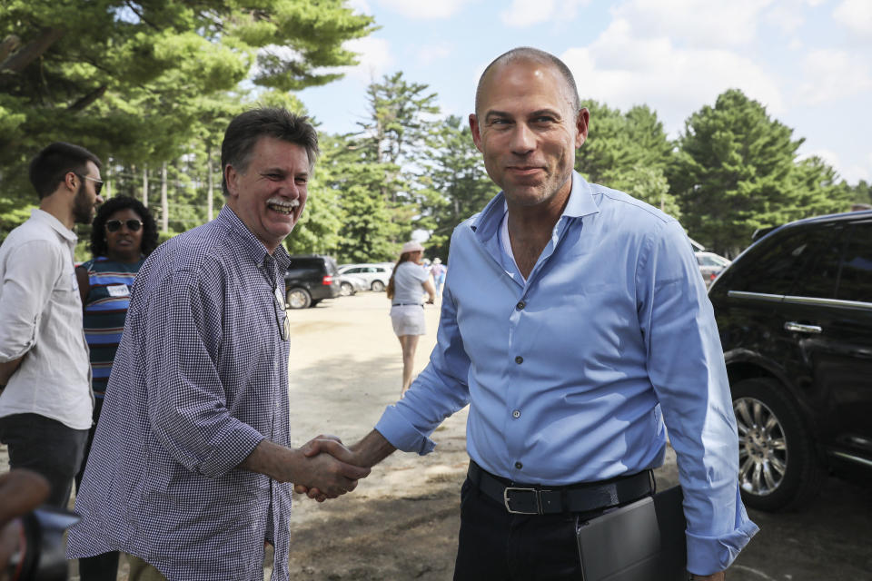 Michael Avenatti, right, an attorney and entrepreneur, arrives to speak at the Hillsborough County Democrats' Summer Picnic fundraiser in Greenfield, N.H. Sunday, Aug.19, 2018. Avenatti, the attorney taking on President Donald Trump over his alleged affair with an adult film actress, is exploring a possible 2020 run for president. (AP Photo/ Cheryl Senter)