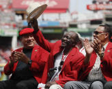 FKILE - In this Saturday, June 17, 2017, file photo, former Cincinnati Reds player Joe Morgan waves to the crowd as he attends a statue dedication ceremony for teammate Pete Rose before a baseball game between the Cincinnati Reds and the Los Angeles Dodgers, in Cincinnati. Joe Morgan has died. A family spokesman says he died at his home Sunday, Oct. 11, 2020, in Danville, Calif.(AP Photo/John Minchillo)