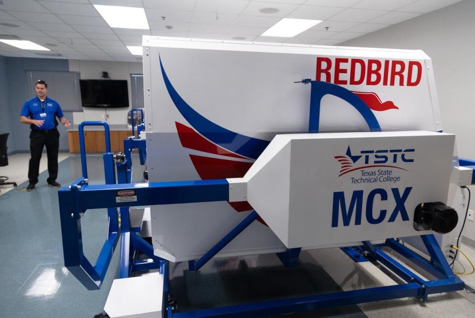 A flight instructor speaks about the benefit of having the Redbird flight simulations for students at the Texas State Technical College in Waco on Oct. 24, 2022.