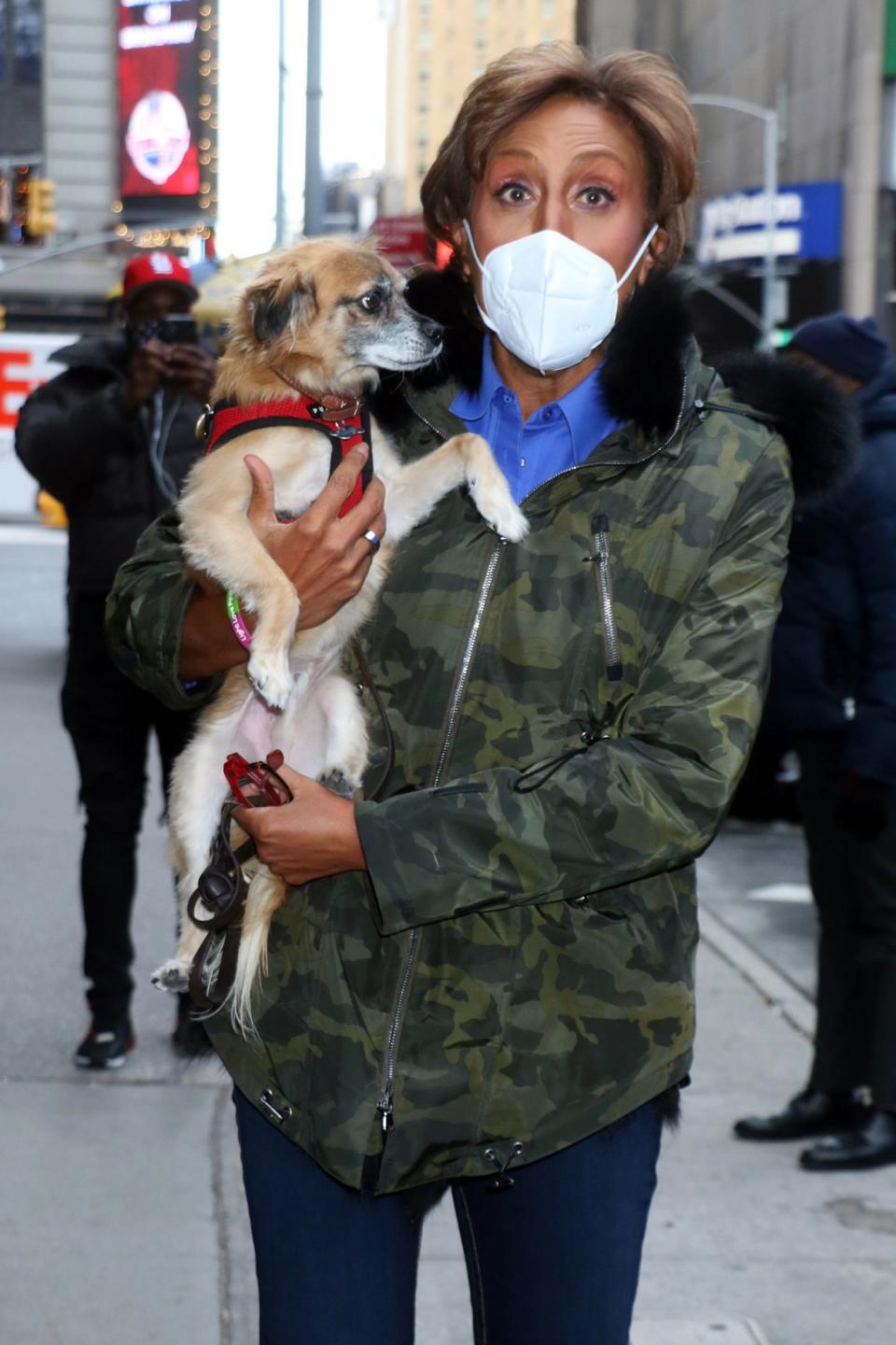 <p>Robin Roberts poses with a pup on the set of <em>Good Morning America</em> on Thursday in N.Y.C.</p>