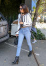 <p>Kendall Jenner puts a Los Angeles twist on autumn dressing with a tiny top and cropped white jacket. And those boots? Totally to die for. </p>