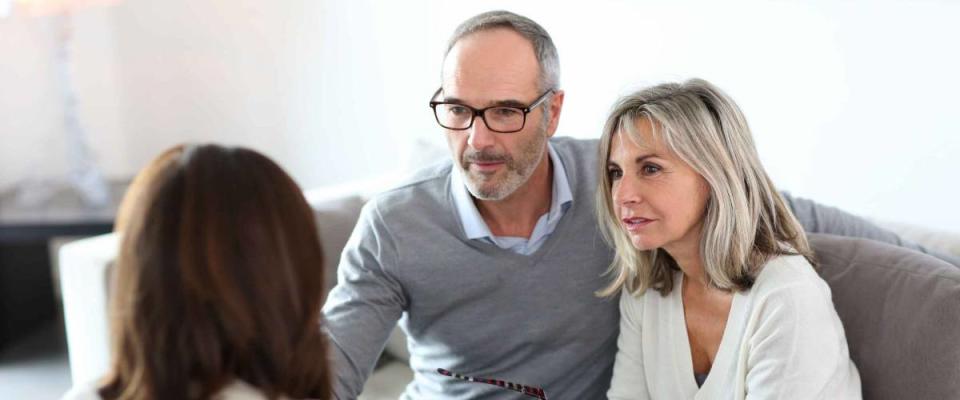 Senior couple meeting financial adviser for investment