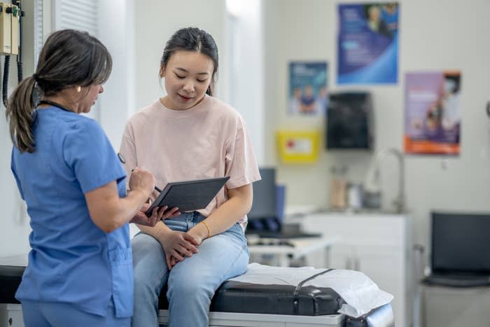 young woman talking with her doctor